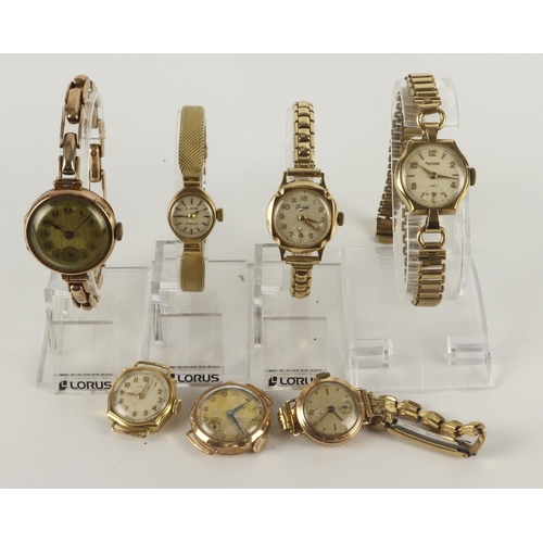 107 - Assortment of seven ladies 9ct cased manual wind wristwatches. All circular dials, four with subsida... 