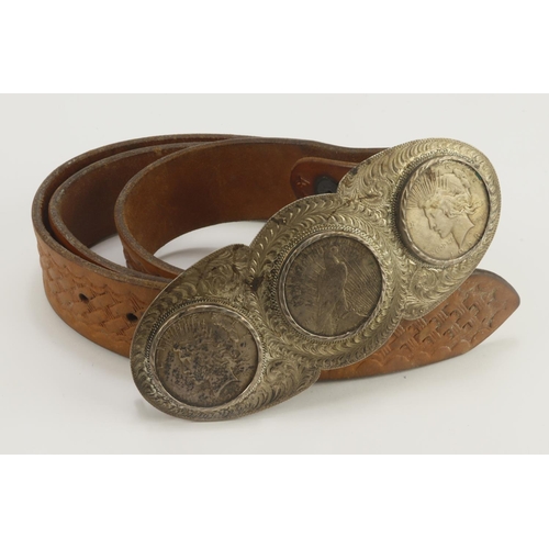 462 - Tex Shoemaker & Sons leather belt, to feature a decorative silver overlay buckle housing three USA L... 