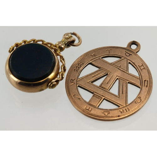 488 - Two fob pendants to include one yellow gold (tests 9ct) swivel set with bloodstone and cornelian. A ... 