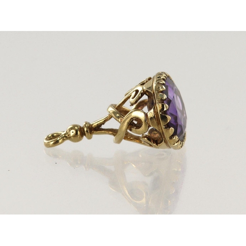 492 - 9ct yellow gold pocket watch fob, set with one oval amethyst measuring 16mm x 12mm, weight 4.3g.