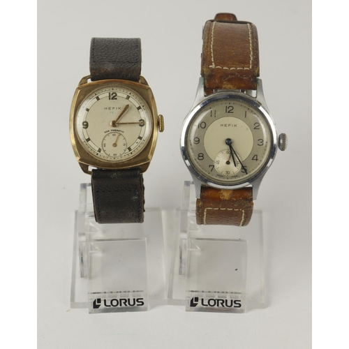 58 - Hefik. Two gents manual wind wristwatches, one 9ct cased the other stainless steel. Both with the su... 