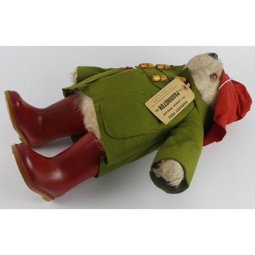 315 - Paddington Bear by Gabrielle, with original label dated 1972, wearing red hat and boots, and a green... 