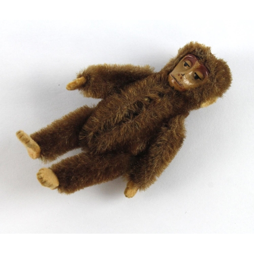 321 - Schuco miniature monkey with articulated limbs, length 90mm approx.