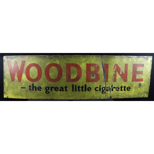 557 - Woodbine. A large enamel 'Woodbine, the great little cigarette' advertsing sign, 152cm x 43cm approx... 