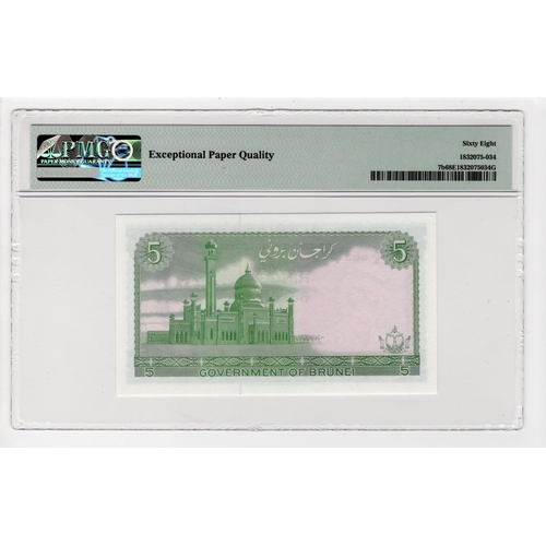 519 - Brunei 5 Ringgit dated 1986, serial A/5 865197 (TBB B107e, Pick7b) in PMG holder graded 68 EPQ Super... 