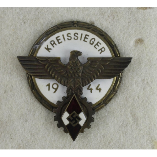 1106 - German Hitler youth cased kreissieger 1944 badge.