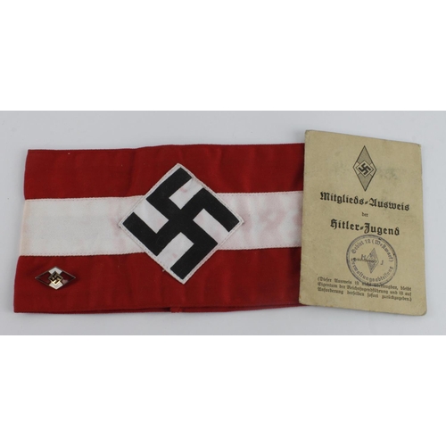 1107 - German Hitler youth membership card with Hitler youth arm band and lapel badge.