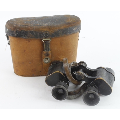 1226 - German WW1 pair of binoculars in their leather case.