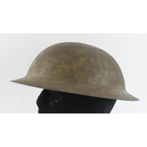 241 - British 1st pattern Broodie helmet, uncrimped edge, stamped to rim 'HS 107'.