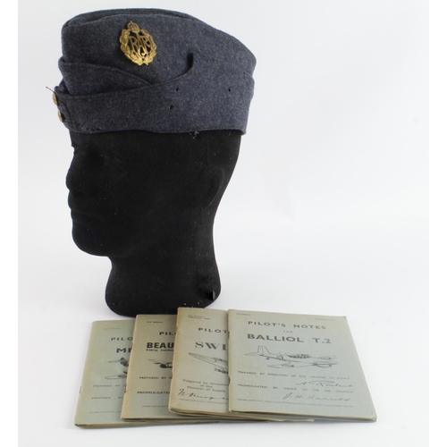 341 - RAF airman’s side hat with pilots note books on the Swift F.7, Beaufighter TFX, Balliol T.2, Meteor ... 