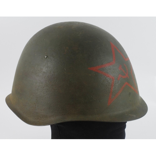 381 - Russian steel helmet complete with liner and chin strap, red star painted to front, service wear.