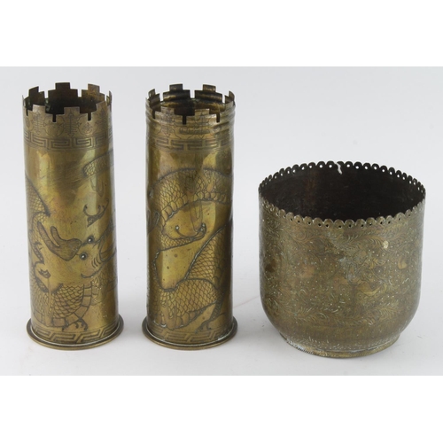 403 - Trench Art shell cases, both decorated with well executed dragon images, plus a Trench Art bowl with... 