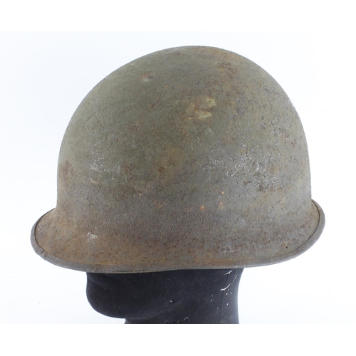 414 - US WW2 steel helmet in untouched condition complete with lining stamped inside with swivel bales and... 