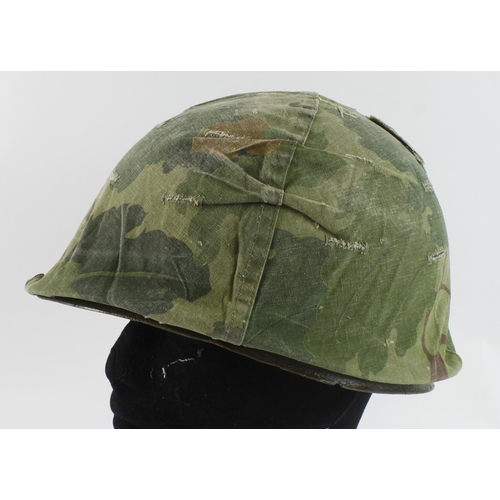 421 - Vietnam War Era US M1 Helmet with reversible Mitch/Duck hunter cover.