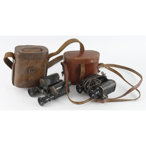 438 - WW1 binoculars two pair in their leather cases.