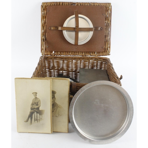 467 - WW1 officers wicker basket with various plates, small burner and two photos of possible owner.