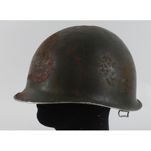 536 - WW2 US Front Seam Swivel Bale M1 Helmet. Badged to a Tank Destroyer Unit. Some pitting and some smal... 