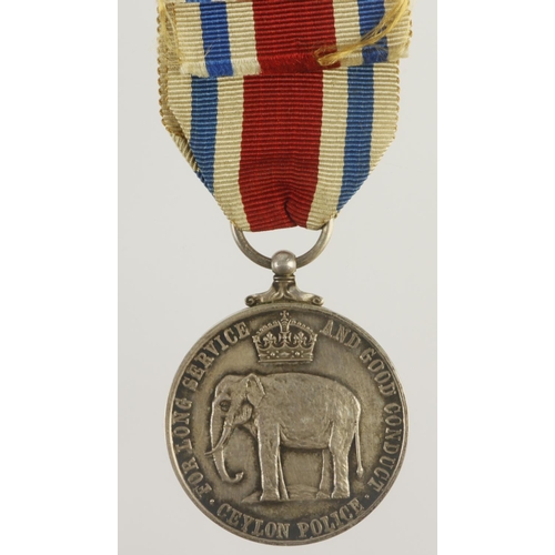 766 - Ceylon Police LSGC Medal GV (crowned) edge marked 'Specimen'.