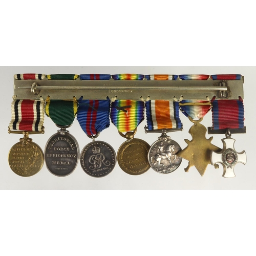 872 - Miniature medal group mounted as worn - DSO GV, 1914 Star Trio with clasp and MID, 1911 Coronation M... 