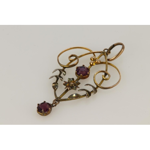 384 - 9ct yellow gold pendant of Art Nouveau style set with two 4mm diameter garnets, weight 1.5g