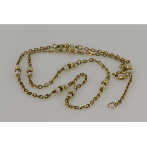 385 - Yellow gold (tests 14ct) freshwater pearl station necklace, eighteen pearls measure approx. 2.5mm ea... 