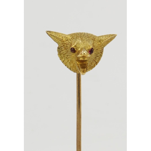 405 - Yellow gold (tests 18ct) antique fox head tie pin, ruby set cabochon eyes, head width 10mm, yellow g... 