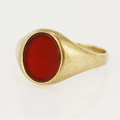 61 - 9ct yellow gold cornelian signet ring, oval table measures 12 x 9mm, finger size X/Y, weight 4.7g.