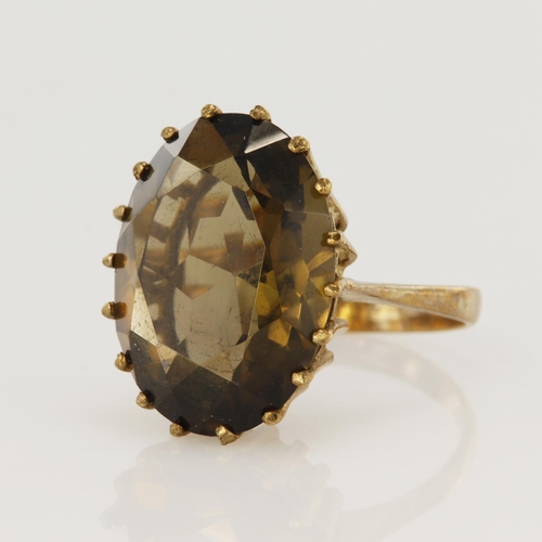 65 - 9ct yellow gold smokey quartz cocktail ring, oval quartz measures 20 x 15mm, finger size P, weight 6... 