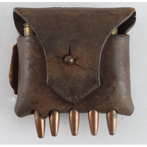 151 - Ammunition pouch (from a Bandoleer or Belt) with a 5 round Mauser clip, leather fractured across fla... 