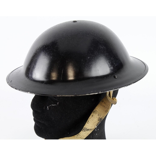 253 - British unissued (?) Home Front helmet with liner and chinstrap, maker marked 'BO & Co 1 43'