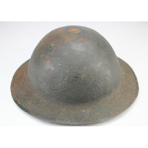 255 - British WW1 Brodie steel helmet, complete with liner and chin strap, possible restoration in places,... 