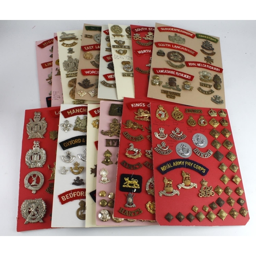 270 - Cap badges / buttons / collars / metal and cloth title collection mounted on boards, wide range of r... 