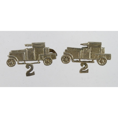 297 - Collar dogs, 2nd light armoured motor car battery, white metal, locally made.