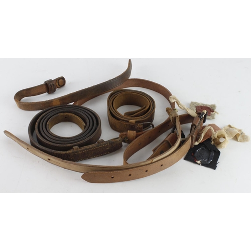 337 - Leather military straps WW1 and WW2 dated with sealed pattern labels.