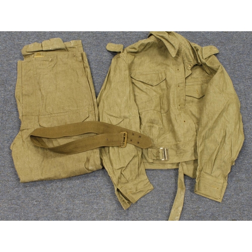 520 - WW2 scarce denim Battle dress blouse and trousers and both dated 1945. Trousers waist 34” to 35”, Ba... 