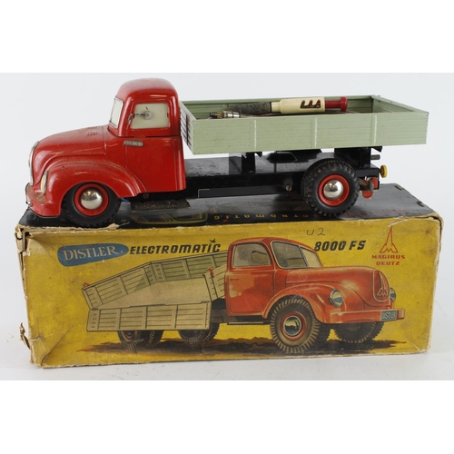 106 - Distler Electromatic 8000FS tinplate battery tipper truck (red cab, green back), damage to battery c... 