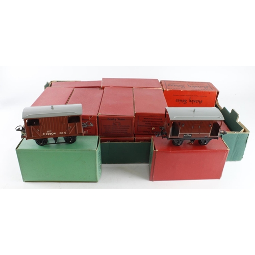 308 - O Gauge. A collection of approximately thirty-two boxed Hornby O gauge model railway, including wago... 