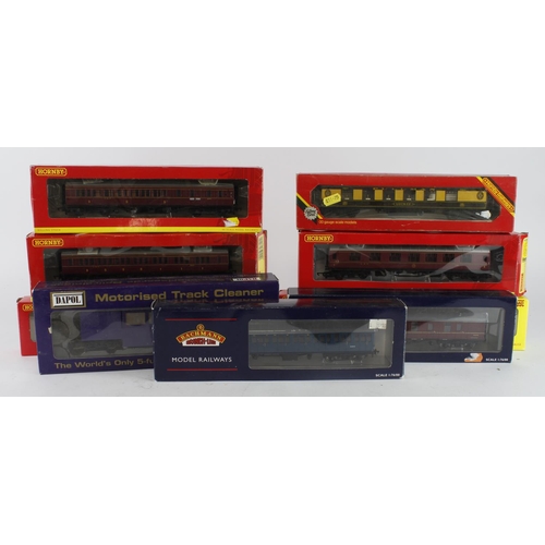 312 - OO gauge. Nine boxed OO gauge rolling stock (mostly coaches), makers comprise Hornby, Bachmann & Dap... 