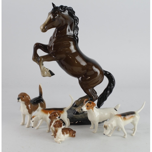 362 - Beswick. Six Beswick figures, comprising Rearing Horse (1014) & five hounds tallest 26cm approx.