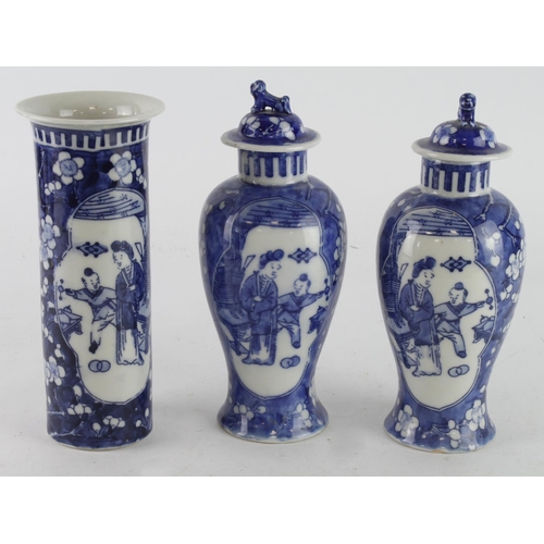 382 - Chinese interest. A pair of chinese vases with lids & another vase, each with Chinese characters to ... 