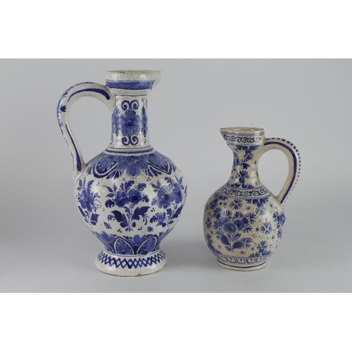 388 - Delft. Two large blue & white jugs / ewers (one marked 'Delft' to base), tallest 30cm approx.