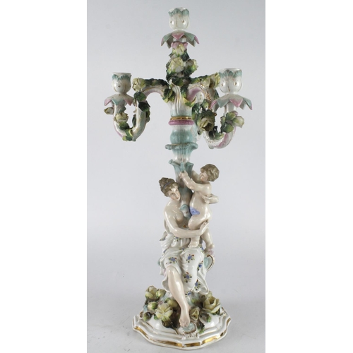 397 - German porcelain candelabra (possibly by Dresden), with three branches, ornately decorated depicting... 