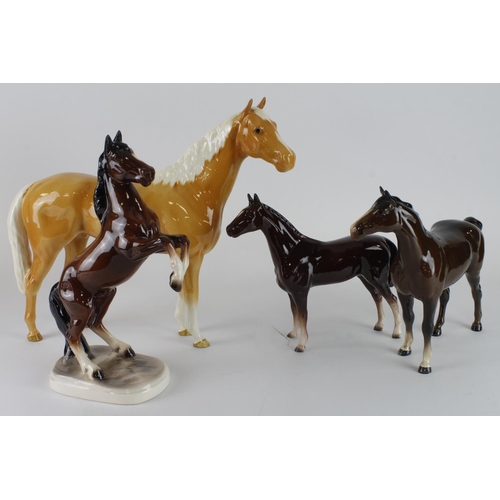 406 - Horses. Four ceramic horses (incl. Beswick), tallest 30cm approx.