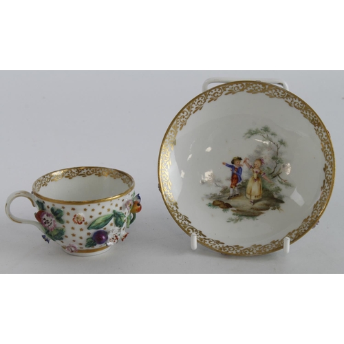 415 - Meissen cup & saucer with ornate floral decoration, saucer bowl decorated with a boy and girl in a w... 