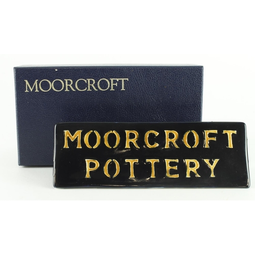 432 - Moorcroft name plaque,  makers marks to base, length 18.5cm approx., contained in a Moorcroft box