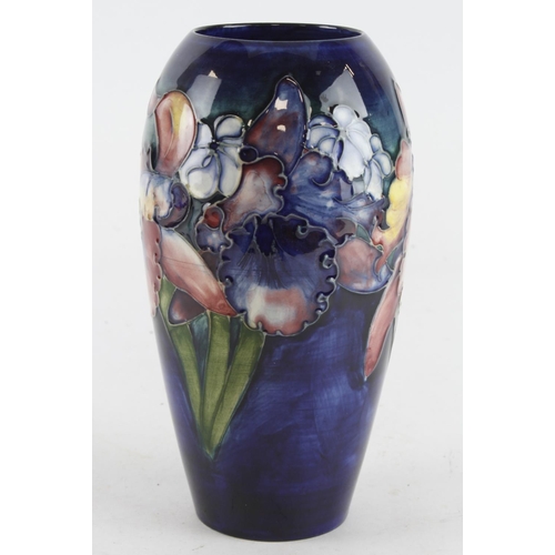 433 - Moorcroft Orchid pattern vase, makers marks to base, height 17.5cm approx.