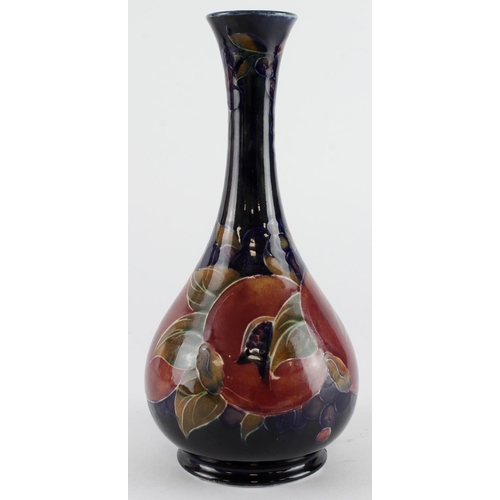 434 - Moorcroft pomegranate pattern vase, makers marks and signed to base, height 21cm approx.