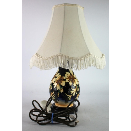 436 - Moorcroft table lamp with shade, makers marks to base, total height 46cm approx.