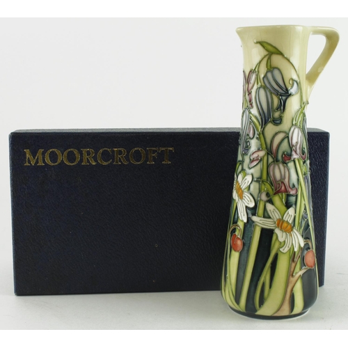 437 - Moorcroft Wild Meadow pattern jug, height 18.5cm approx., contained in a Moorcroft box