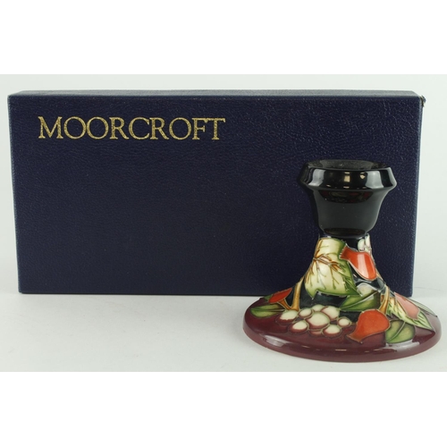 438 - Moorcroft Winter Harvest pattern candlestick holder, makers marks to base, height 8cm approx.